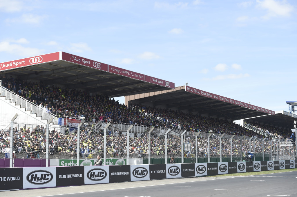 Fans watching the 24 Hours of Le Mans race in a grandstand